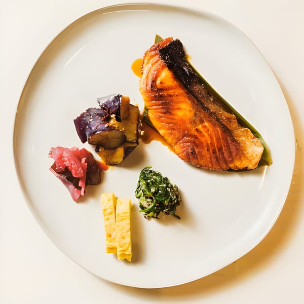 Nem's Japandi Bistro's Japanese dish with grilled salmon, eggplant, pickled vegetables, and tamagoyaki.